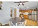Eat-in kitchen featuring a table, stainless steel appliances, wooden cabinets, and tile flooring at 4662 Nibbs Ln, North Charleston, SC 29418