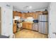 Bright kitchen features stainless steel appliances and wood-look flooring, great for cooking and entertaining at 4662 Nibbs Ln, North Charleston, SC 29418