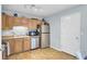 Bright kitchen features stainless steel appliances and wood-look flooring at 4662 Nibbs Ln, North Charleston, SC 29418