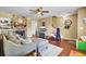 Comfortable living room with hardwood floors, fireplace, ceiling fan and easy access to the second floor at 4662 Nibbs Ln, North Charleston, SC 29418