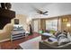 Open concept living room featuring wood floors, neutral walls, ceiling fan, and entertainment area at 4662 Nibbs Ln, North Charleston, SC 29418