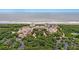 Expansive aerial view of resort with beach access, lush landscaping and parking at 4943 Green Dolphin Way, Kiawah Island, SC 29455