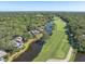 Aerial view of golf course with surrounding water and lush green trees at 4943 Green Dolphin Way, Kiawah Island, SC 29455