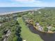 Stunning aerial view of beachfront community, lush golf course and surrounding waterways at 4943 Green Dolphin Way, Kiawah Island, SC 29455