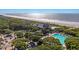 Beautiful aerial view of oceanfront property with beach access and resort style pool at 4943 Green Dolphin Way, Kiawah Island, SC 29455