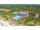 Aerial view featuring a community pool, beach access and surrounding landscaping at 4943 Green Dolphin Way, Kiawah Island, SC 29455