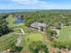 Beautiful aerial view showcasing the golf course, clubhouse, and lush greenery at 4943 Green Dolphin Way, Kiawah Island, SC 29455