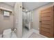 Contemporary bathroom with glass shower, tiled walls, and modern fixtures at 4943 Green Dolphin Way, Kiawah Island, SC 29455
