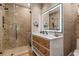 This bathroom boasts a glass shower, stylish vanity, neutral palette, and modern finishes at 4943 Green Dolphin Way, Kiawah Island, SC 29455