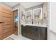 Modern bathroom featuring double vanity, contemporary mirrors, and luxury finishes at 4943 Green Dolphin Way, Kiawah Island, SC 29455