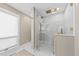 Bright bathroom with glass-enclosed shower, rainfall shower head, and neutral color scheme at 4943 Green Dolphin Way, Kiawah Island, SC 29455