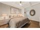 Relaxing bedroom features coffered ceilings, an elegant sunburst mirror, and en suite bathroom at 4943 Green Dolphin Way, Kiawah Island, SC 29455
