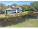 Waterfront property with a scenic view, spacious deck, and lush landscaping at 4943 Green Dolphin Way, Kiawah Island, SC 29455