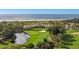 Picturesque golf course with pond, sand trap, and ocean views at 4943 Green Dolphin Way, Kiawah Island, SC 29455