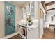 Stylish kitchen with stainless steel appliances, white cabinetry and marble countertop space at 4943 Green Dolphin Way, Kiawah Island, SC 29455