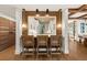 Modern kitchen featuring a breakfast bar with seating, pendant lights, and view to the kitchen at 4943 Green Dolphin Way, Kiawah Island, SC 29455