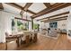 Open concept living and dining area with exposed wood beams and bright, airy design at 4943 Green Dolphin Way, Kiawah Island, SC 29455