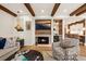 Living room with a fireplace, entertainment center, and an open design to the kitchen bar at 4943 Green Dolphin Way, Kiawah Island, SC 29455