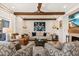 Cozy living room featuring wood beam ceilings, a ceiling fan, and stylish decor at 4943 Green Dolphin Way, Kiawah Island, SC 29455