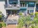 Multi-story patio with comfortable seating, lush greenery, and outdoor living space at 4943 Green Dolphin Way, Kiawah Island, SC 29455