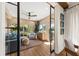 Comfortable sun room with large windows, fan, stylish furnishings and hardwood flooring at 4943 Green Dolphin Way, Kiawah Island, SC 29455