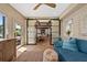 Cozy sun room boasts with natural light, comfortable seating, and views of the outdoor area at 4943 Green Dolphin Way, Kiawah Island, SC 29455
