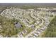Aerial view of a residential community with ponds, tree-lined streets, and well-maintained homes at 4987 Ballantine Dr, Summerville, SC 29485