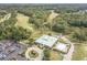 Aerial view of a clubhouse next to a golf course, surrounded by lush greenery at 4987 Ballantine Dr, Summerville, SC 29485