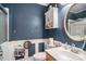 Bathroom features a sink, toilet, a cabinet, and a framed mirror at 4987 Ballantine Dr, Summerville, SC 29485