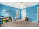 Bright bedroom featuring colorful walls, carpet flooring, and a window providing natural light at 4987 Ballantine Dr, Summerville, SC 29485