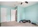 Bright bedroom with neutral carpet, ceiling fan, and two white doors at 4987 Ballantine Dr, Summerville, SC 29485