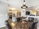 Open dining area with a marble table that connects seamlessly to the kitchen and living spaces at 4987 Ballantine Dr, Summerville, SC 29485