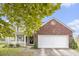 Charming two-story home with brick accents and an attached garage on a sunny day at 4987 Ballantine Dr, Summerville, SC 29485