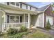 Inviting front porch with white railings and lush landscaping for added curb appeal at 4987 Ballantine Dr, Summerville, SC 29485