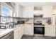 Well-lit kitchen featuring white cabinetry, stainless steel appliances, and modern countertops at 4987 Ballantine Dr, Summerville, SC 29485