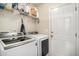 Laundry room with modern Samsung washer and dryer and overhead storage at 4987 Ballantine Dr, Summerville, SC 29485