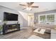 Cozy living room with a fireplace, neutral colors, and stylish flooring at 4987 Ballantine Dr, Summerville, SC 29485