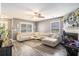 Spacious living room with a large sectional sofa, fireplace, and plenty of natural light at 4987 Ballantine Dr, Summerville, SC 29485