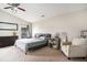 Bright main bedroom with a large window, neutral decor, and comfortable seating at 4987 Ballantine Dr, Summerville, SC 29485
