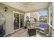 Relax on the screened porch with a fire pit and ceiling fan at 4987 Ballantine Dr, Summerville, SC 29485