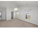 Spacious bedroom with neutral carpet, a ceiling fan and a walk-in closet at 5040 Thornton Dr, Summerville, SC 29485