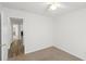 Bedroom with an open door offers a glimpse of a warmly lit living space at 5040 Thornton Dr, Summerville, SC 29485