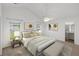 Staged bedroom featuring a large bed, side table and a bench at 5040 Thornton Dr, Summerville, SC 29485