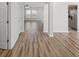 Open-concept design showcasing hardwood floors and seamless flow to living and kitchen areas at 5040 Thornton Dr, Summerville, SC 29485