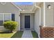 Welcoming front door with classic design details, brick accents, and a well-manicured lawn at 5040 Thornton Dr, Summerville, SC 29485