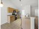 Open kitchen features wood cabinets, stainless steel appliances, and tiled flooring at 5040 Thornton Dr, Summerville, SC 29485