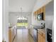 Open kitchen features sliding glass doors to a fenced-in backyard at 5040 Thornton Dr, Summerville, SC 29485