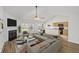 Bright living room features vaulted ceilings, a fireplace, and updated decor at 5040 Thornton Dr, Summerville, SC 29485