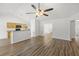 Open-concept living room with hardwood floors, bright walls, and seamless transition to the kitchen at 5040 Thornton Dr, Summerville, SC 29485