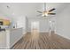 Spacious living room with hardwood floors, ample natural light, and seamless flow into the kitchen at 5040 Thornton Dr, Summerville, SC 29485